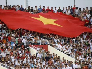 Vietnamese football fans embracing the flag at the centre of this WYD controversy. Up to ten percent of Vietnam's 82 million population are Catholics (Getty)